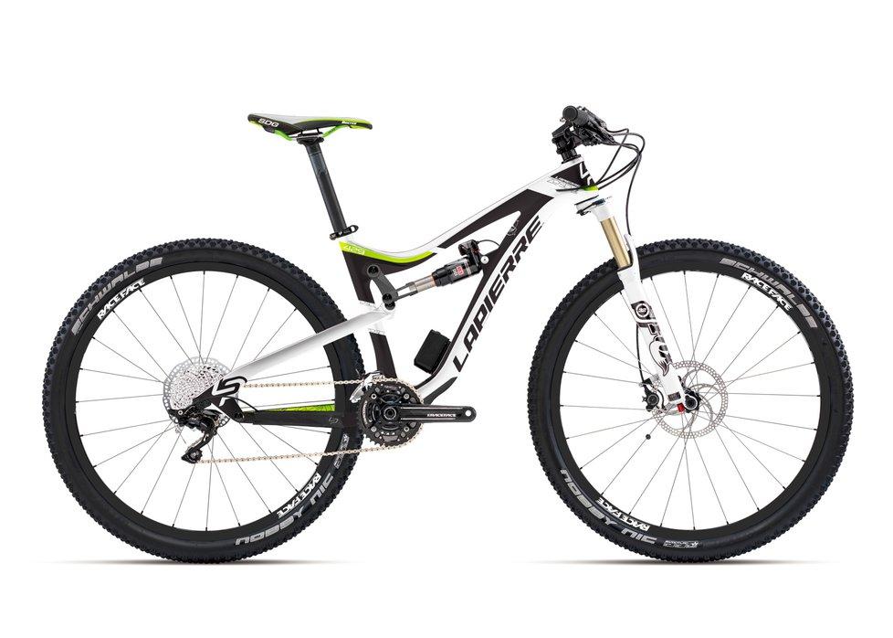 Lapierre Zesty Trail 429: A high-performance mountain bike with a sleek white and black frame, featuring vibrant green accents. The bike has sturdy black tires designed for off-road terrain, a front suspension fork, and a rear shock for enhanced stability. The drivetrain is equipped with multiple gears, and the handlebars are angled for optimal control. Ideal for mountain biking enthusiasts.