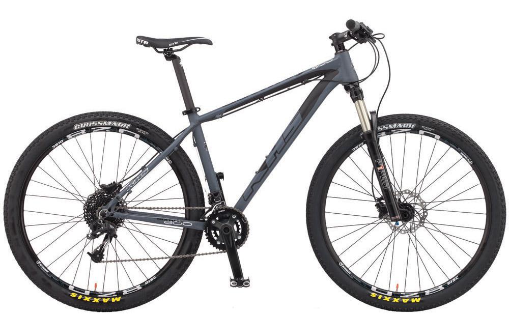 KHS SixFifty 600: Mountain bike with a gray frame, equipped with disc brakes and thick tires. The bike features a front suspension fork and a 1x gear system, suitable for off-road riding.