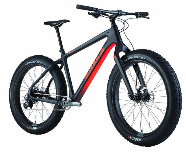 Salsa Beargrease Carbon XX1: A sleek black and red fat bike with wide tires, designed for rugged terrain. The bike features a lightweight frame, a comfortable seat, and sturdy handlebars, highlighting its durability and performance capabilities.