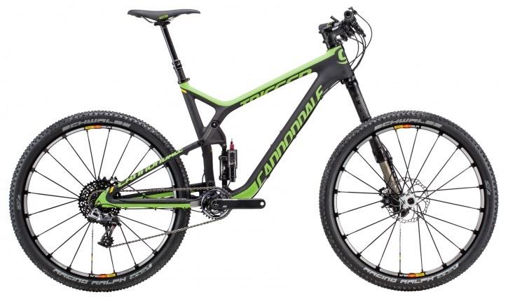 Cannondale Trigger Carbon Team 27.5: A black and green Cannondale mountain bike with a lightweight frame, featuring front and rear suspension, disc brakes, and wide tires suitable for off-road riding. The bike is positioned on a white background, showcasing its sleek design and modern components.
