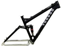 Voodoo Cycles Canzo 29er F/S: A black bicycle frame with a silver rear triangle, featuring the brand name "Voodoo" printed on the top and side. The frame is designed for a mountain bike, including suspension components.