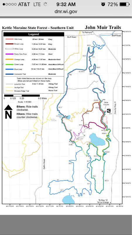 Map of the Kettle Moraine State Forest - Southern Unit, featuring hiking and biking trails with a color-coded legend indicating trail types and difficulty levels. The map displays various loops and routes, including the Ice Age Trail and Moraine Ridge Trail, with directions for bikers and hikers. John Muir Trails mountain bike trail.