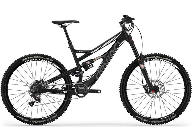 Devinci Spartan: A modern black mountain bike with a dual suspension system, featuring sturdy tires and disc brakes, positioned against a white background.