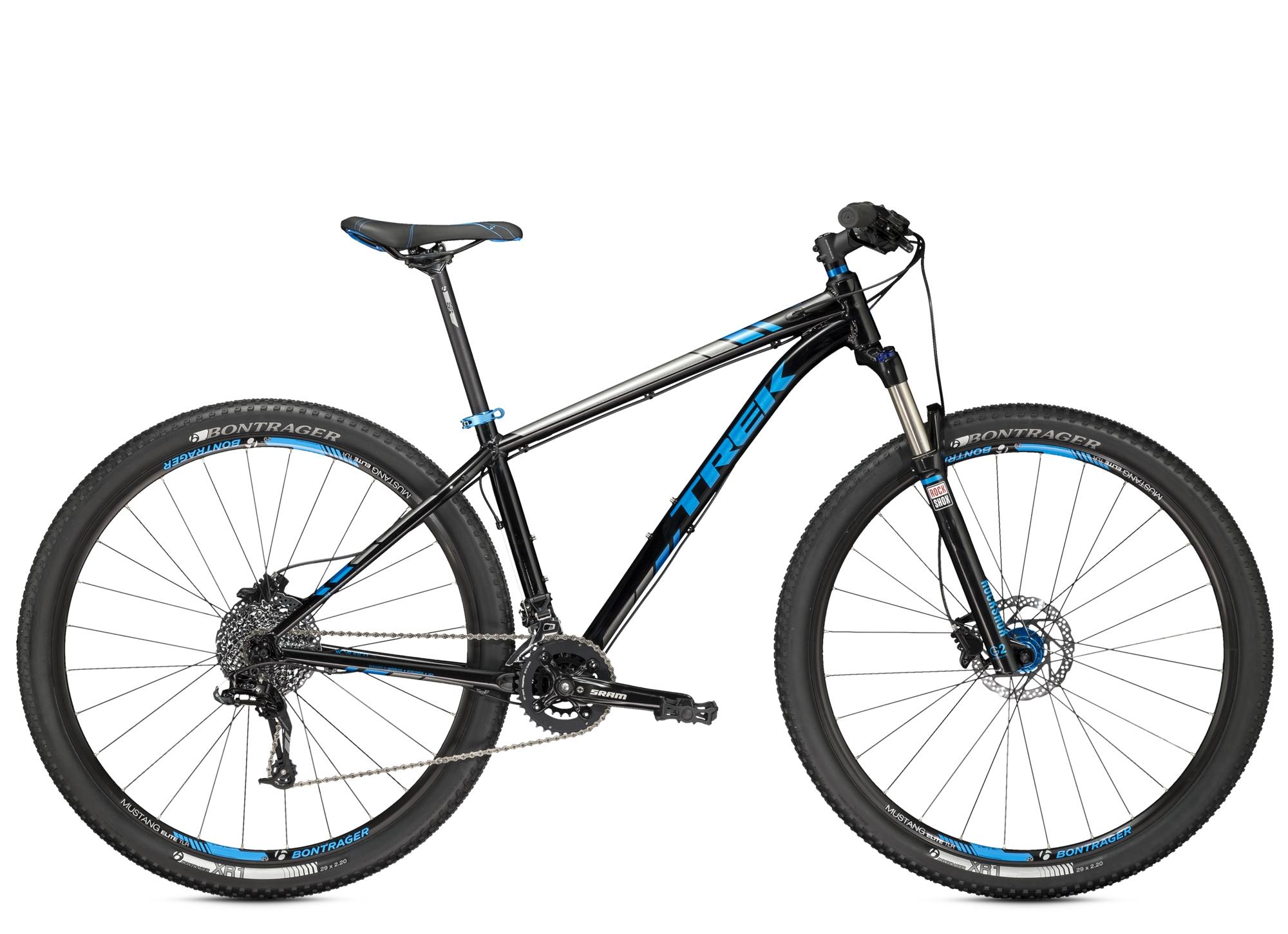 Trek X-Caliber 8: A black and blue Trek mountain bike featuring a sturdy frame, suspension fork, and wide tires designed for off-road cycling. The bike is shown from a side angle, highlighting its components including the handlebars, drivetrain, and disc brakes.