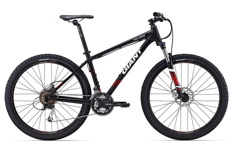 Alt text: A black mountain bike with red accents, featuring a lightweight frame, thick tires, and front suspension, displayed against a white background.
