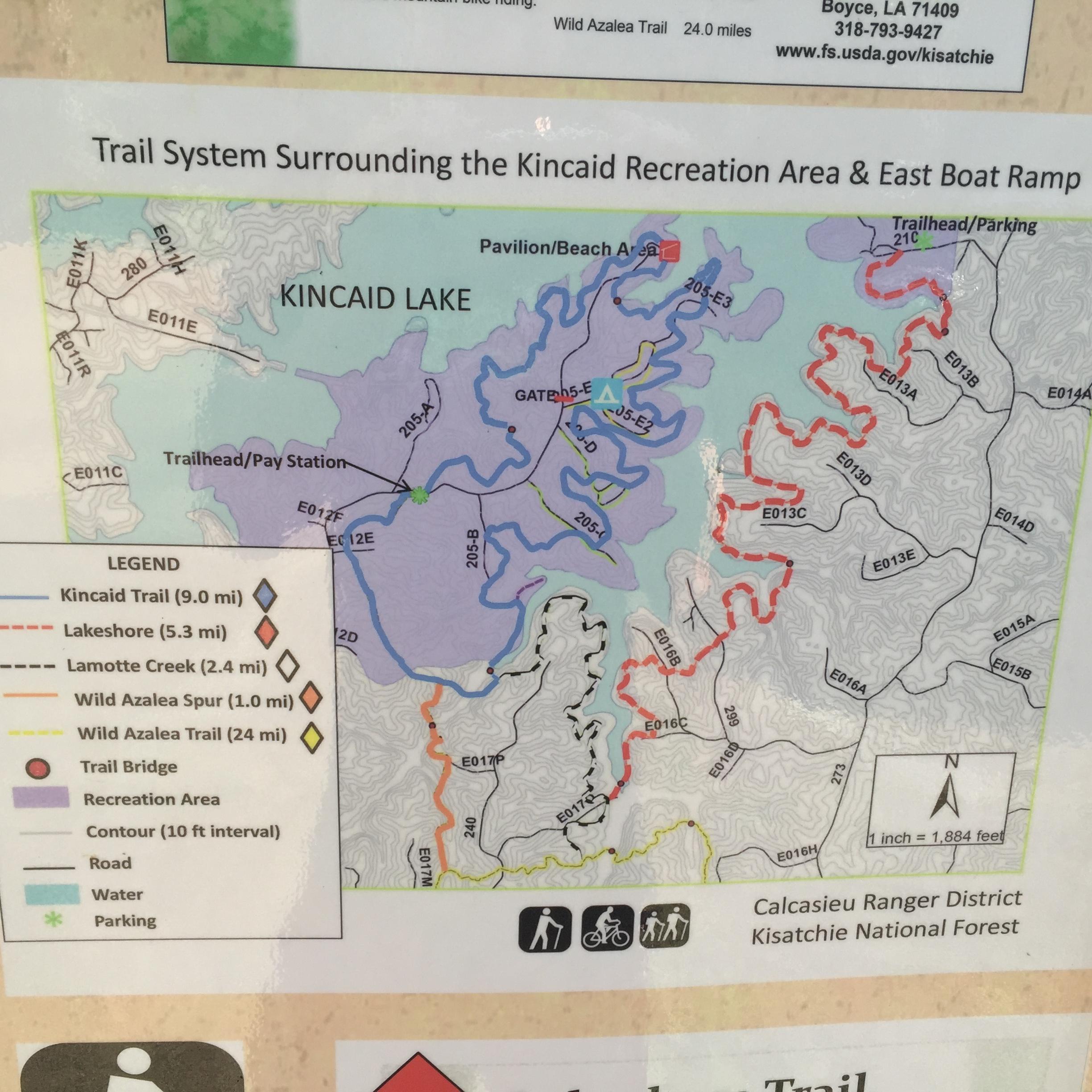 Map of the trail system surrounding Kincaid Recreation Area and East Boat Ramp, depicting Kincaid Lake and various trails including Kincaid Trail, Lakeshore, and Wild Azalea Trail, along with parking and recreational areas. Includes a legend and directional indicators. Kincaid Lakeshore Trail mountain bike trail.