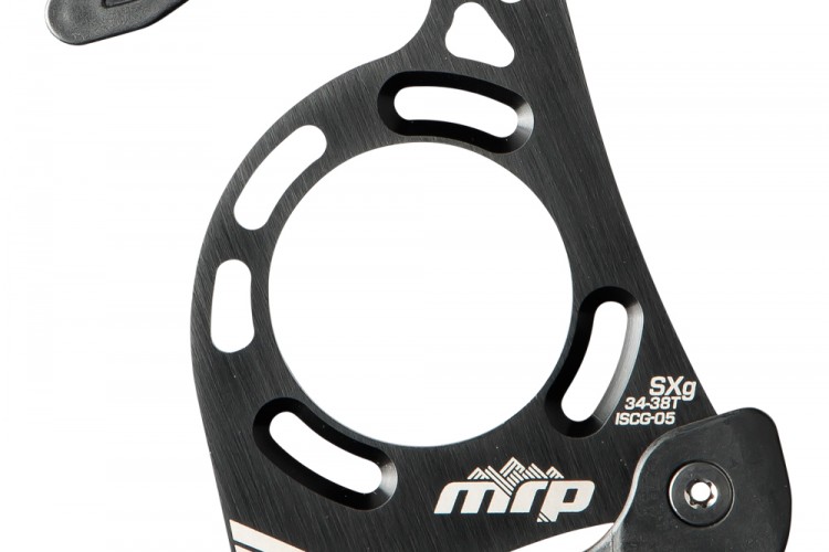 An MRP SXg chain guide in black aluminum, featuring a circular design with cutouts and a mounting bracket. The guide is labeled with "MRP" and specifications for chainring sizes (34-38T) and ISCG type (ISCG-05). The image highlights the sleek construction and adjustable features for optimal performance in mountain biking.