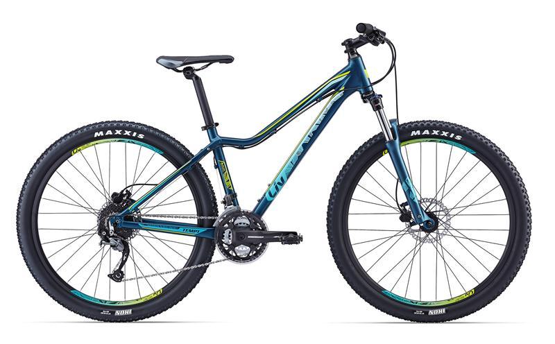 Giant Giant Liv Tempte 3: A mountain bike with a blue and green frame, equipped with wide tires labeled "Maxxis," front suspension, and a multi-gear drivetrain. The handlebars are designed for trail riding, and the bike features disc brakes for enhanced stopping power.
