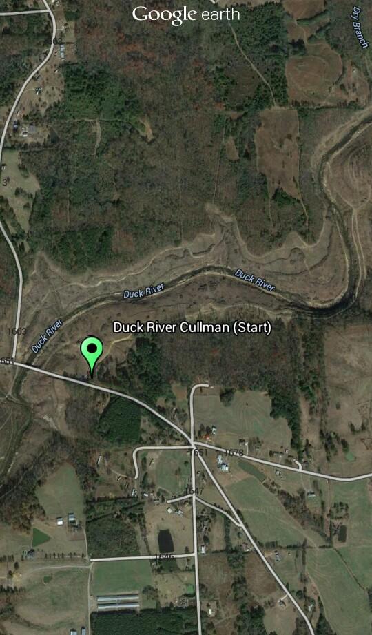 A satellite view of the Duck River in Cullman, showing the river's winding path through the landscape, along with surrounding roads and farmland. The starting point is marked with a green pin labeled "Duck River Cullman (Start)." Duck River mountain bike trail.