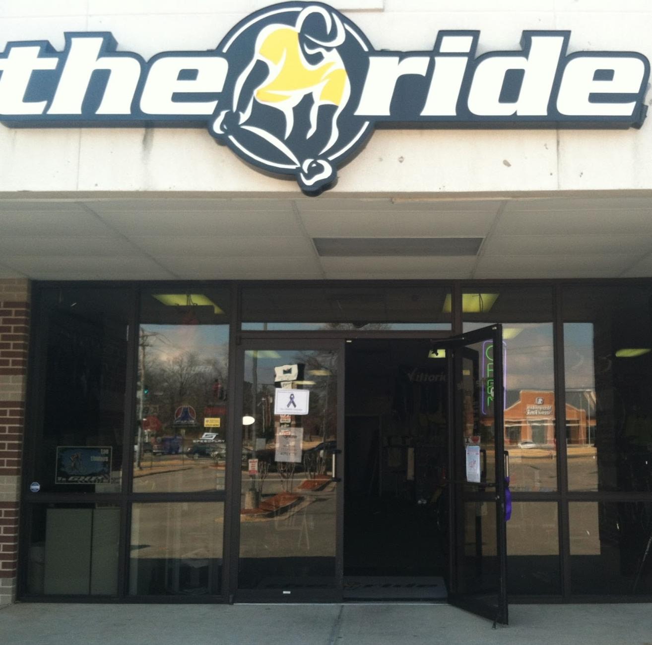 Image of the entrance to a store named "the ride." The storefront features large signage with a cyclist graphic and the store