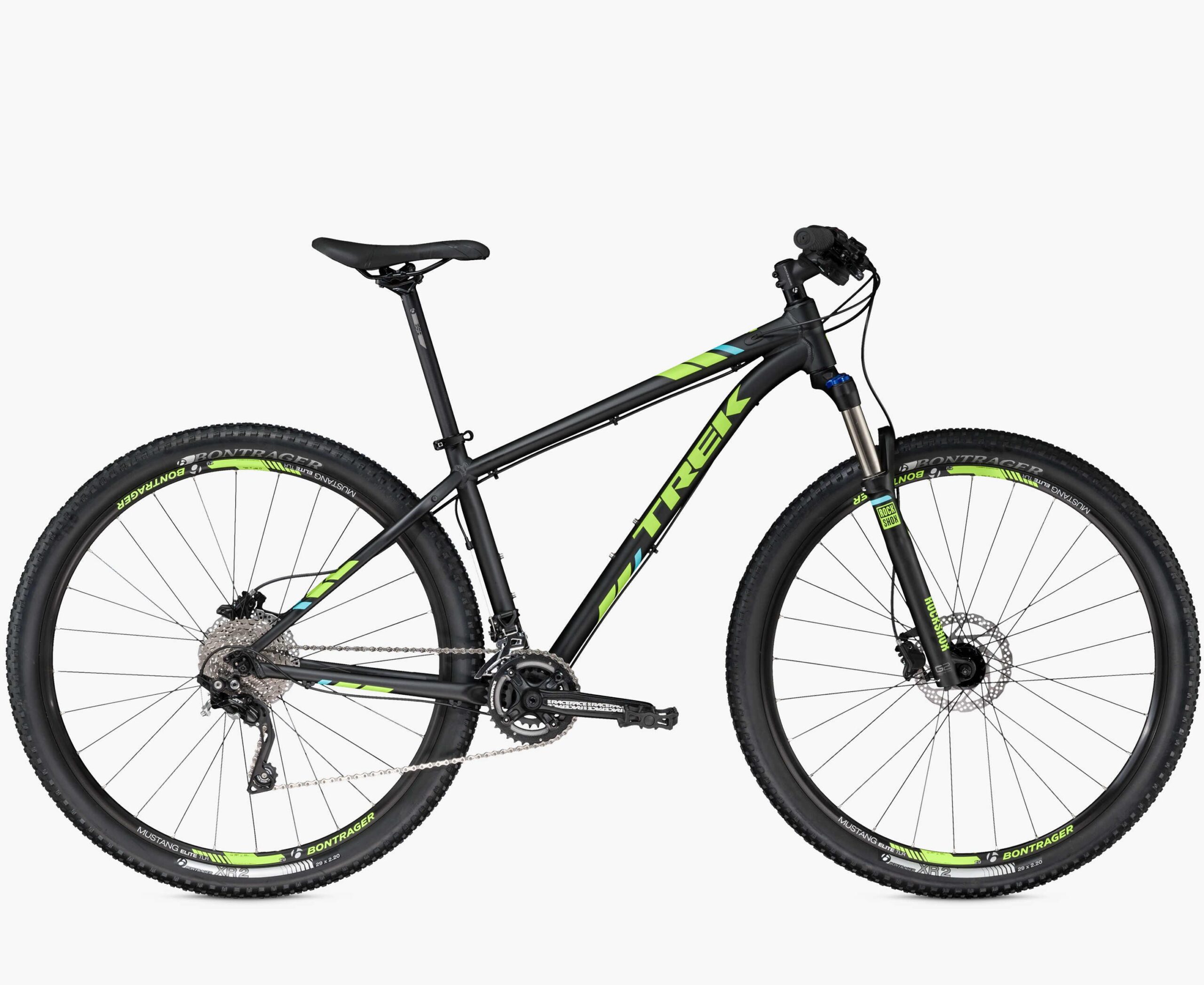 Trek X-Caliber 9: Alt text: A black and green mountain bike with a modern design, featuring a lightweight frame, wide tires, and front suspension. The bike is positioned at an angle to show the handlebars and gear system.