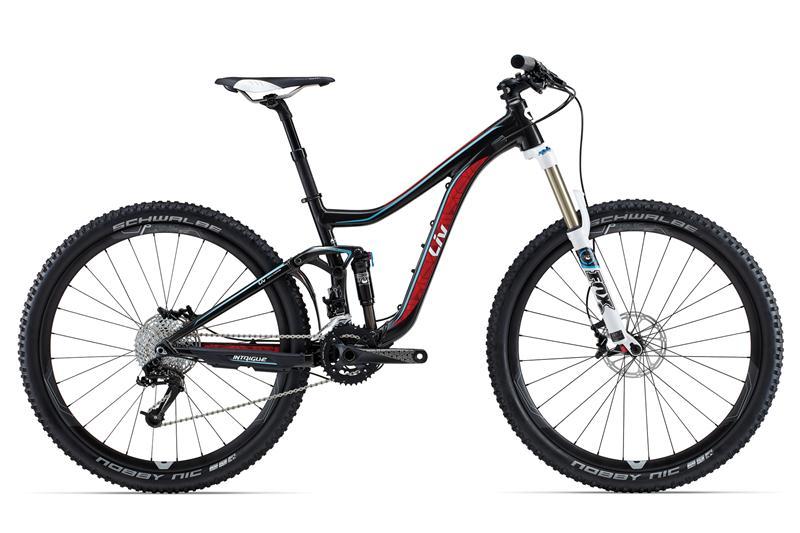 Giant Intrigue 1 (Liv): A black and red mountain bike with distinctive features, including large, knobby tires, a dual-suspension frame, and a white saddle. The bike is positioned on a plain white background, showcasing its sleek design and components.