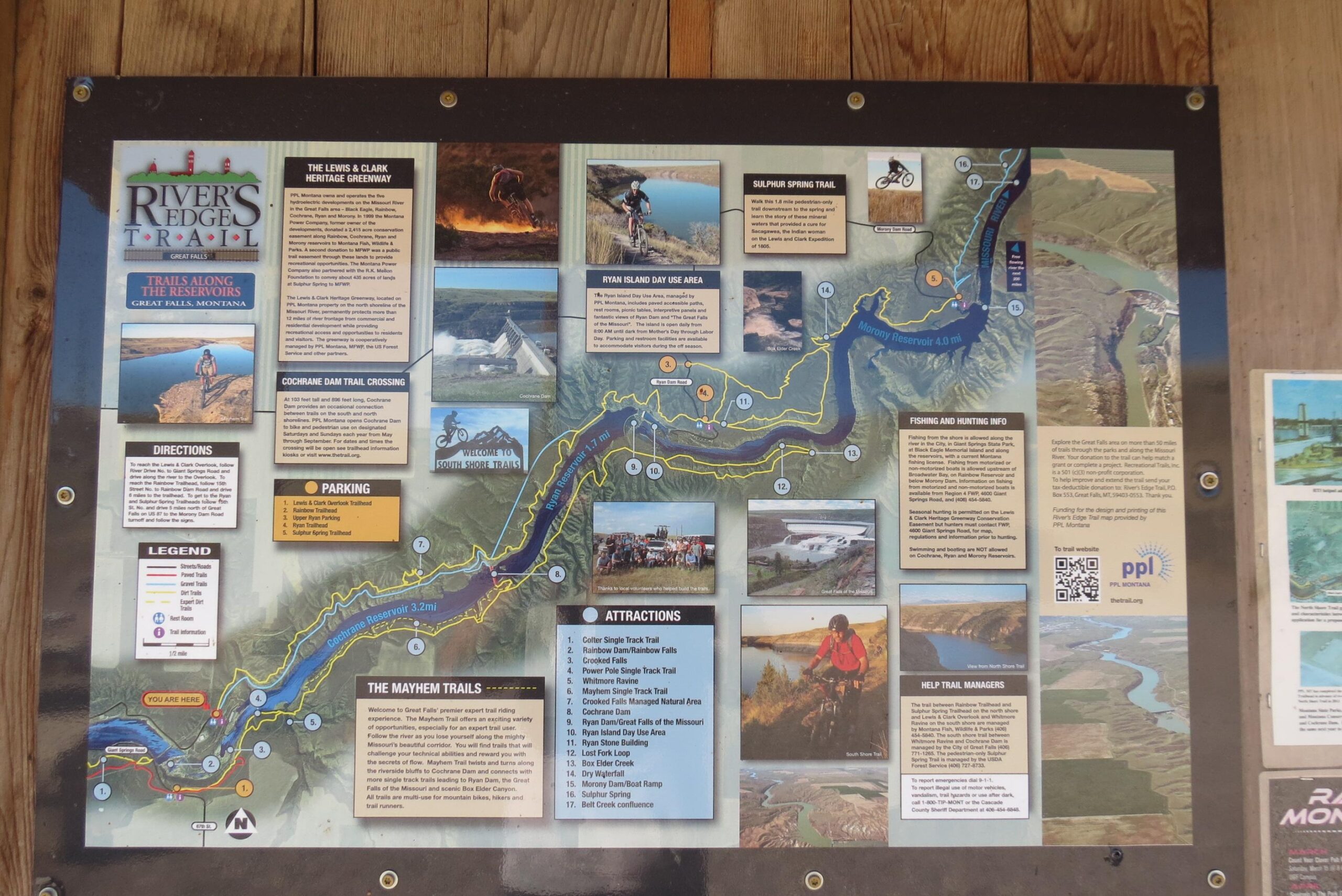 A detailed informational map of the River's Edge Trail in Great Falls, Montana, featuring local attractions, trails, directions, parking information, and tips for fishing and hunting. The map includes images of scenic spots, trail routes indicated in yellow, and highlights points of interest along the river, with a legend for reference. New Video Game/Yeah Kid mountain bike trail.