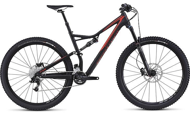 Specialized Rockhopper Pro Disc: A black and red mountain bike with a lightweight frame, full suspension, and wide tires, designed for off-road riding. The bike features a disc brake system and a Shimano gear set, suitable for various terrains.