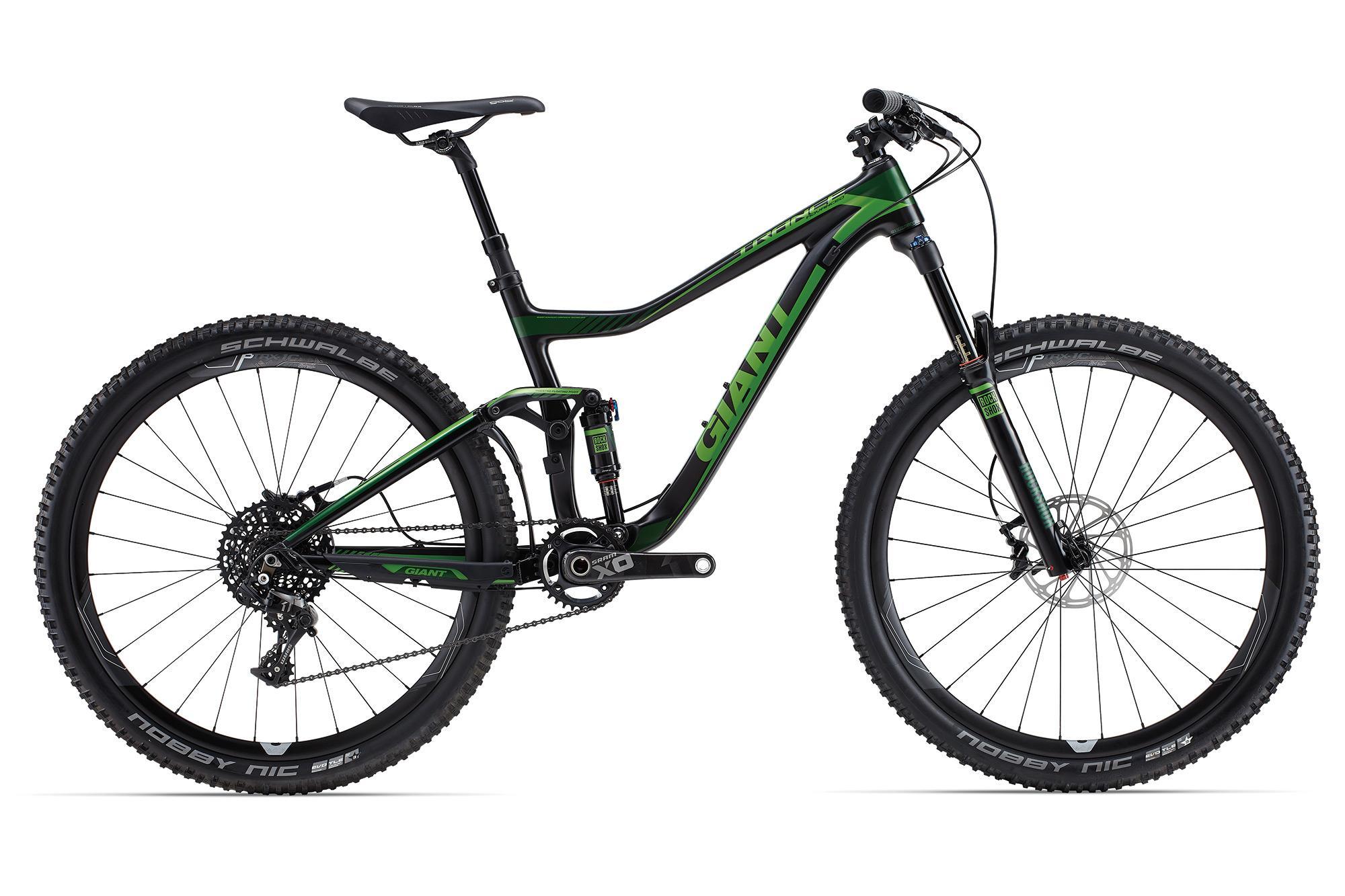 Giant Trance Advanced 1 27.5: Alt text: A side view of a green and black mountain bike with a lightweight frame, thick tires, and a suspension system, showcasing the handlebars, seat, and drivetrain components.