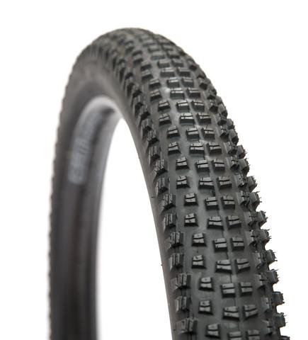 WTB Trail Boss 3.0: Close-up image of a black mountain bike tire, featuring a knobby tread pattern designed for traction on rough terrain. The tire is positioned at an angle, showcasing its textured surface and robust construction.