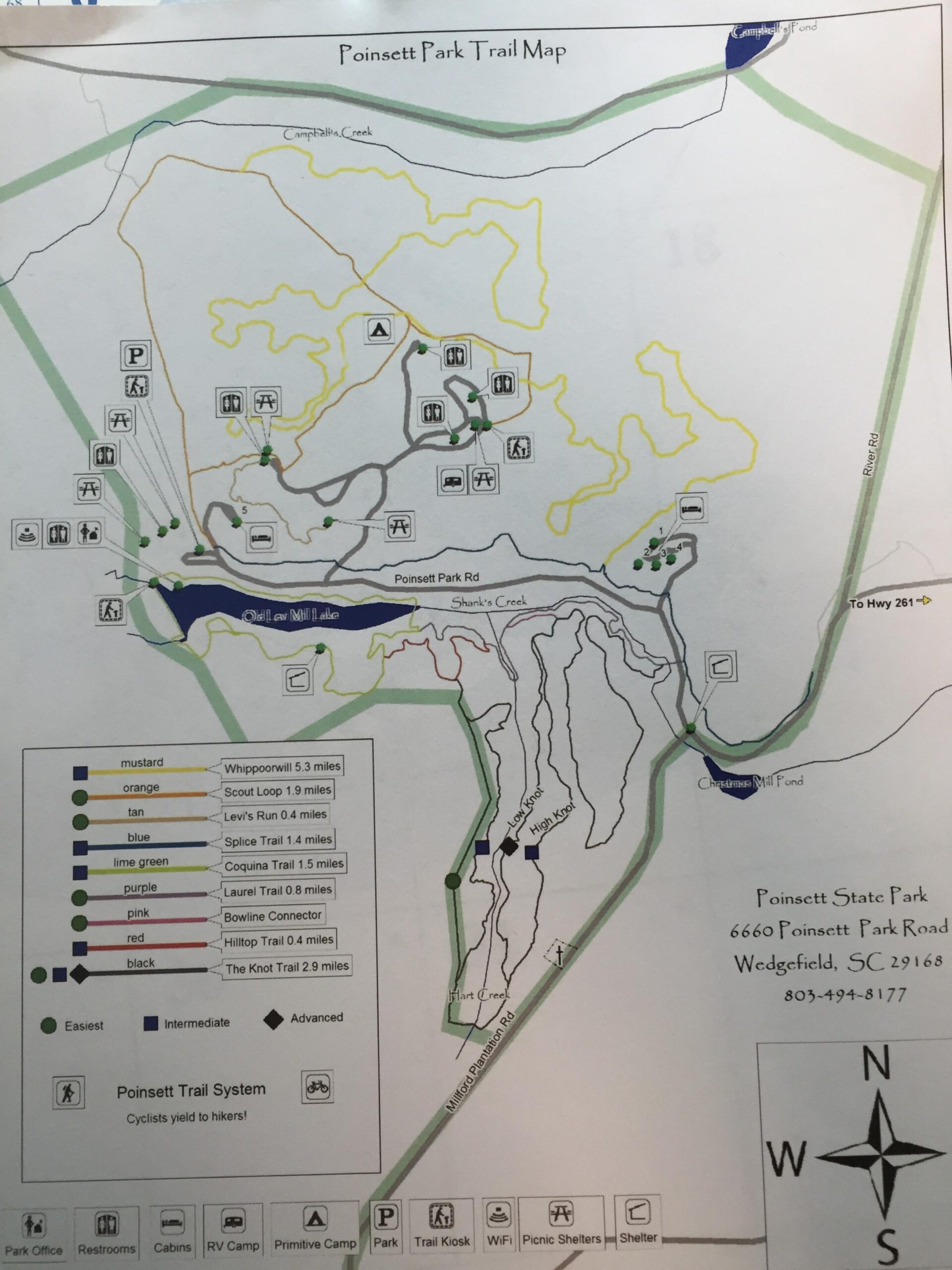 Map of Poinsett State Park Trail, displaying various hiking trails, campgrounds, and points of interest. The map includes trails marked by difficulty level, mileage, and trailhead locations along with symbols for picnic areas and facilities. The orientation shows north and includes major roads and landmarks within the park. Poinsett State Park mountain bike trail.