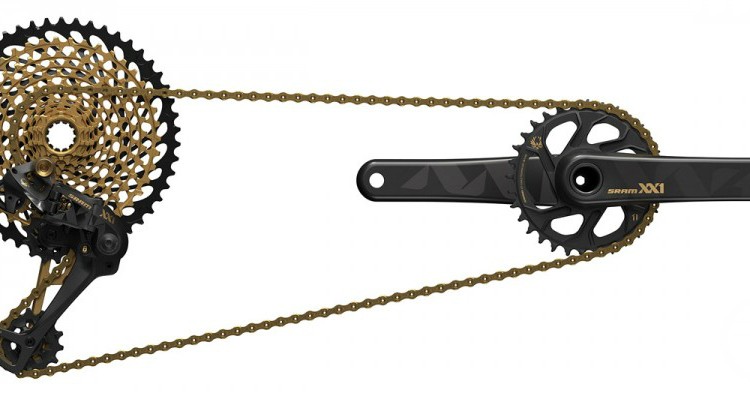 Alt text: Image of a SRAM XX1 bike drivetrain showing a black and gold 12-speed cassette, derailleur, crankset, and chain, designed for high-performance cycling.