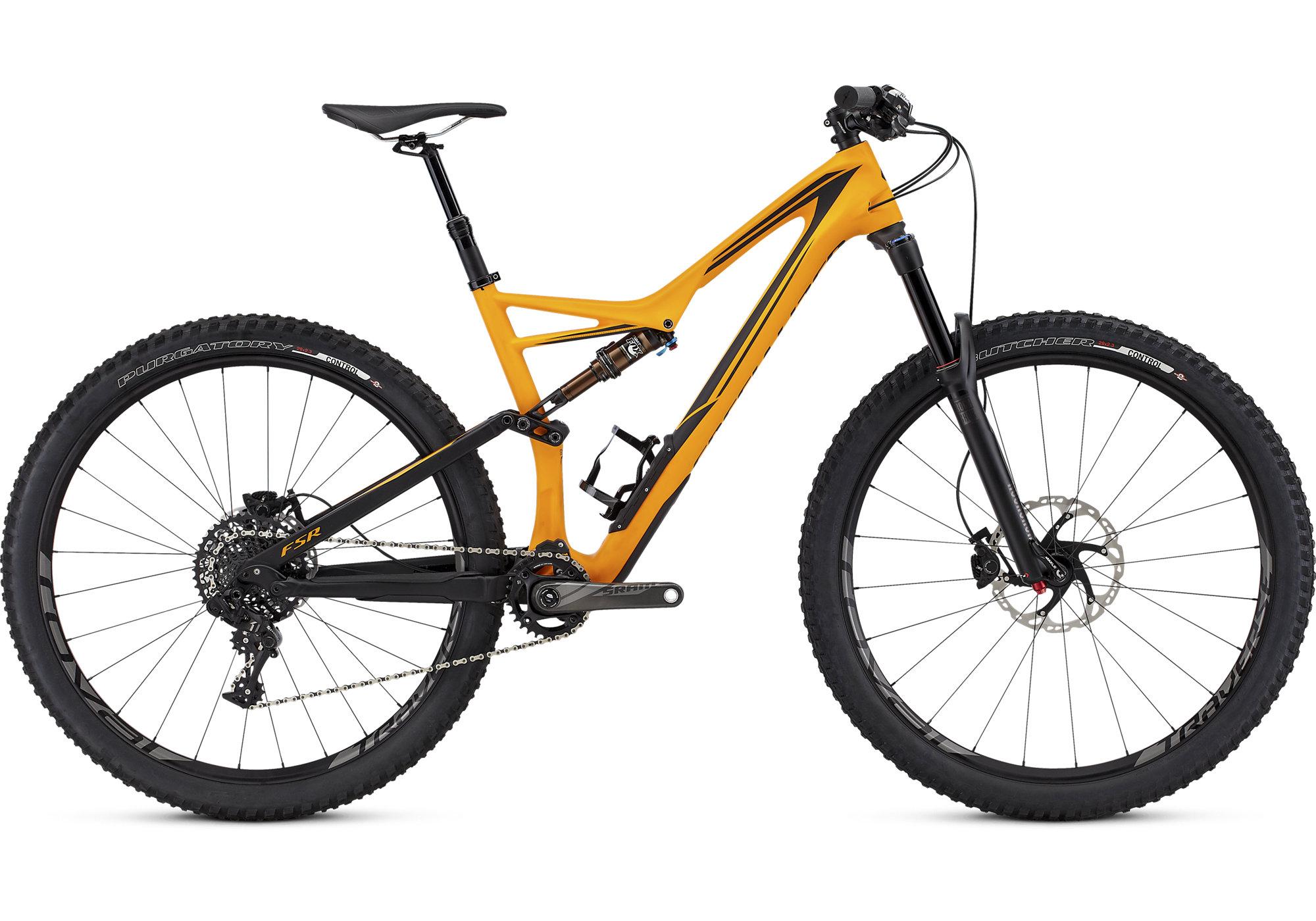 Specialized Stumpjumper FSR Expert 29: A sleek mountain bike featuring a vibrant orange and black frame design, equipped with wide tires suitable for rugged terrain, a dropper seat post, and modern gear components. The bike is positioned against a clean white background, highlighting its streamlined design and sporty appearance.