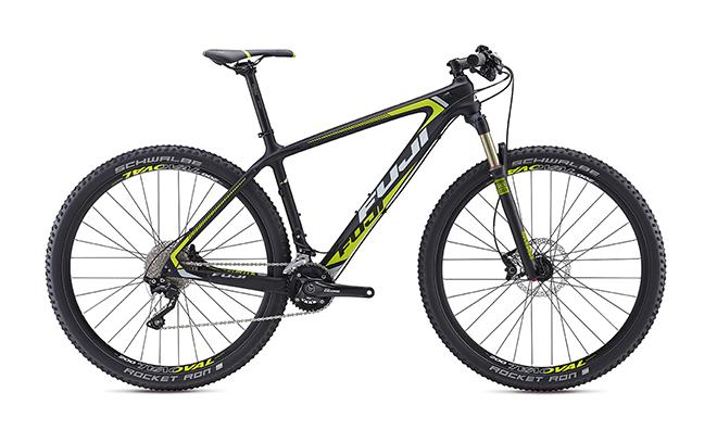 Fuji Fuji SLM 2.5: A high-performance black and neon yellow mountain bike featuring a lightweight carbon frame, front suspension, and sleek design, suitable for off-road trails and competitive cycling.
