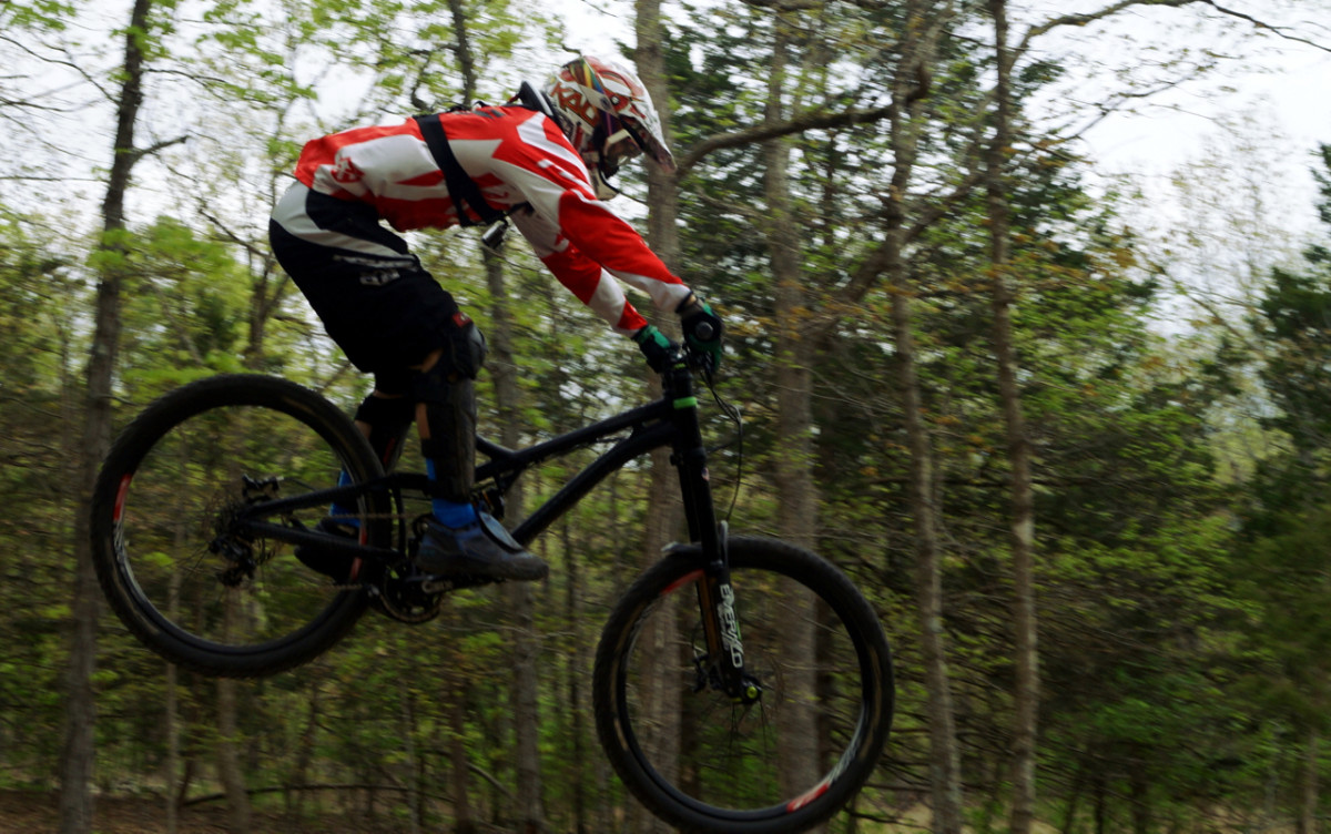 Tanner Stolt, who races for Mojo Cycling and Diety Components, presents the air show at Lake Leatherwood. 