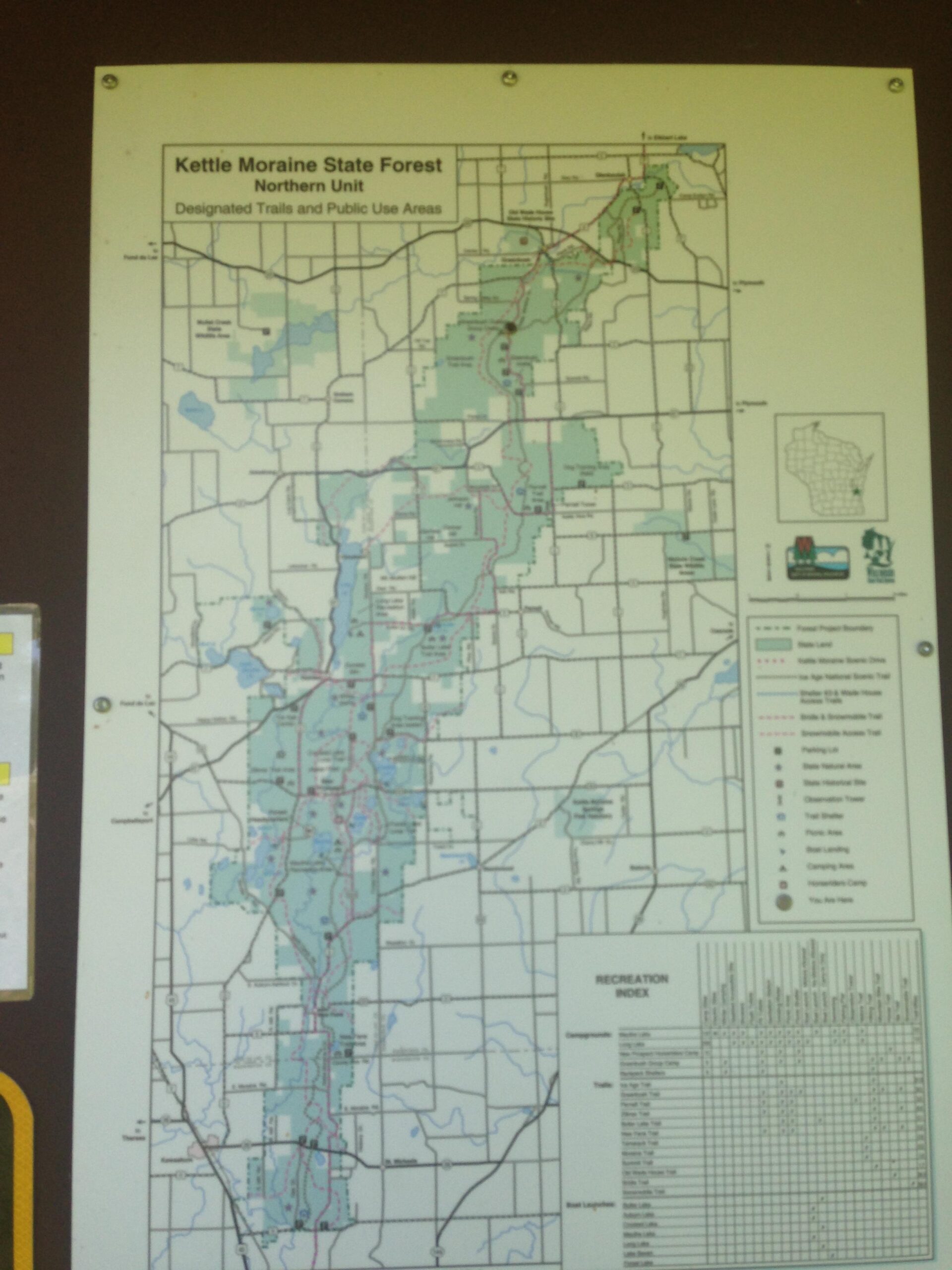 Map of Kettle Moraine State Forest Northern Unit, showing designated trails and public use areas, along with a recreation index detailing various geographic and trail features. Greenbush mountain bike trail.