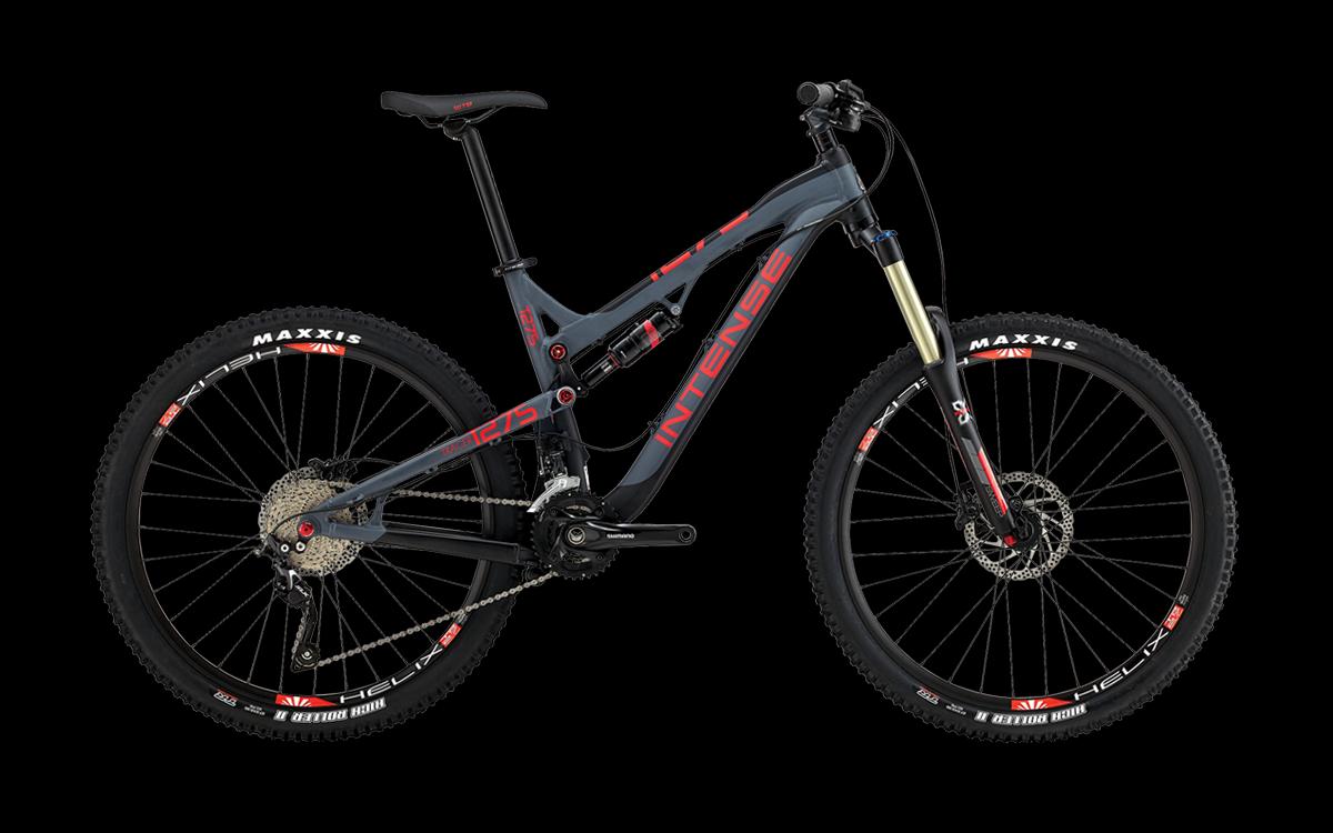 Intense Tracer 275: A modern mountain bike in a sleek black and gray color scheme, featuring high-performance components, large tires, and disc brakes. The frame displays the brand "Intense" prominently, emphasizing its rugged design suitable for off-road cycling.