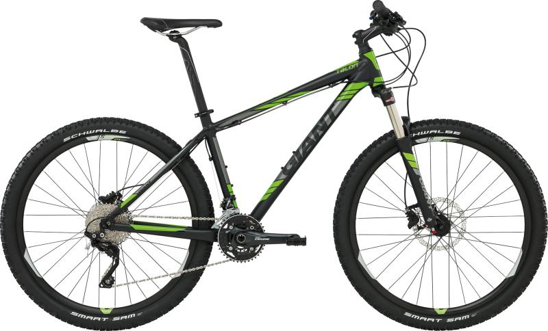 Giant Talon 29er: Mountain bike with black and green frame, featuring dual suspension, wide tires, and disc brakes. The bike is designed for off-road use and has a modern geometric shape.