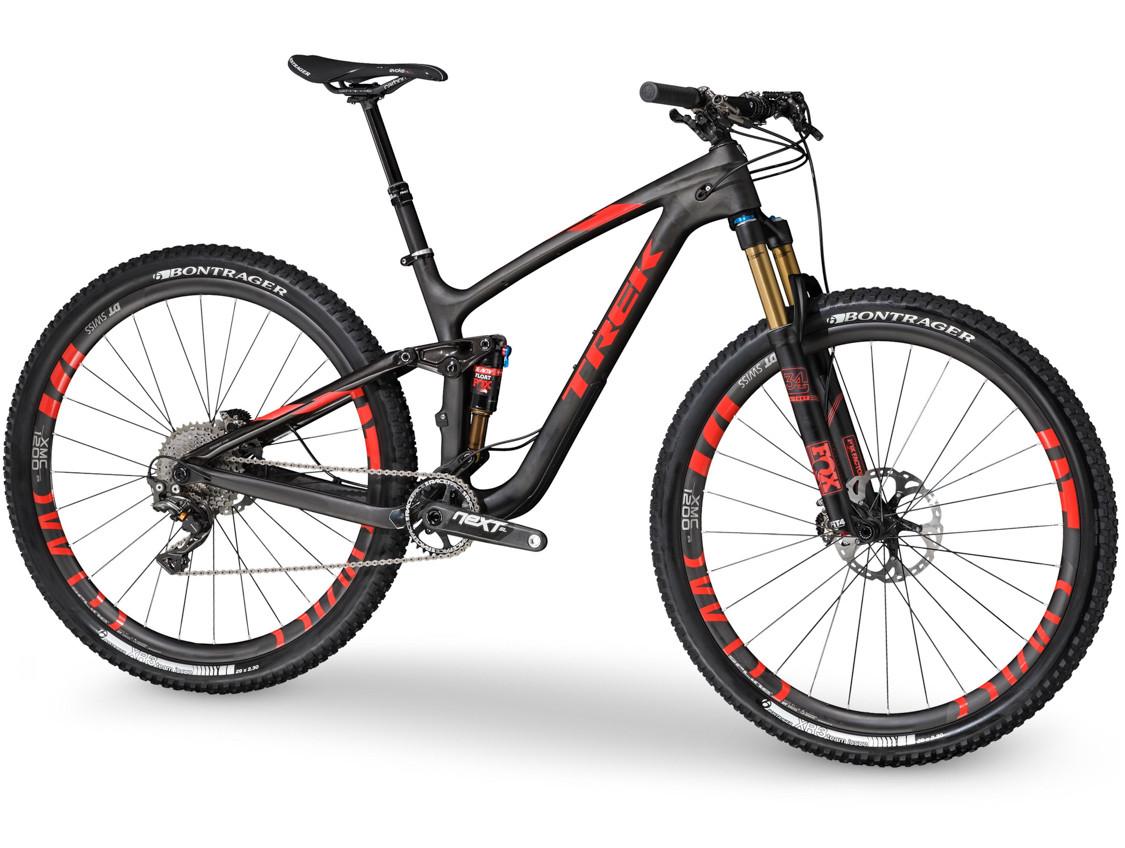 Trek Fuel EX 8 29: A sleek black mountain bike with red accents, featuring a lightweight frame, front suspension fork, and high-performance tires. The bike is equipped with disc brakes and a modern drivetrain, showcasing the brand name "Trek" prominently on the frame. The overall design highlights its suitability for rugged terrain and biking enthusiasts.