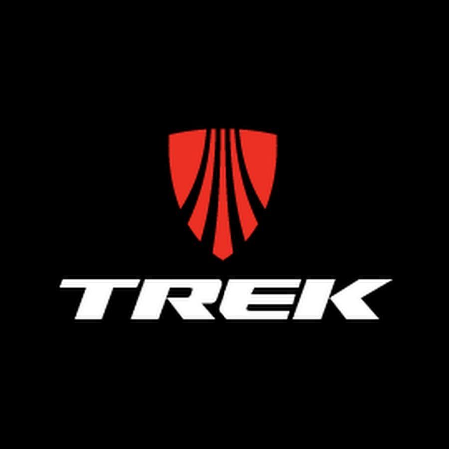 Trek logo featuring a red shield with stylized lines and the word "TREK" in white text, set against a black background.