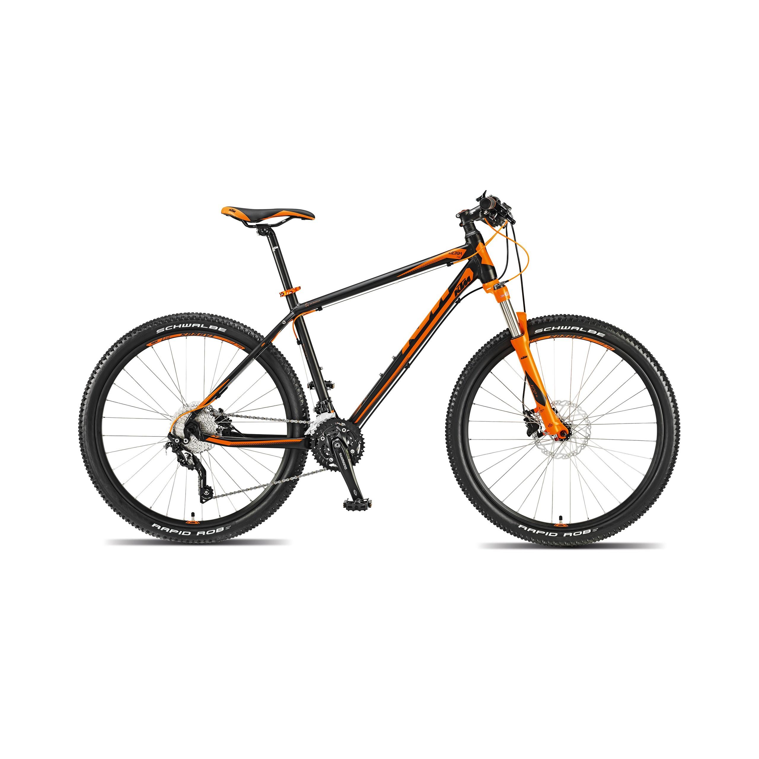 Ktm Ultra Fire 27: A black and orange mountain bike with a lightweight frame, featuring dual suspension, wide tires with textured tread, and a modern gear system. The bike is positioned on a white background.