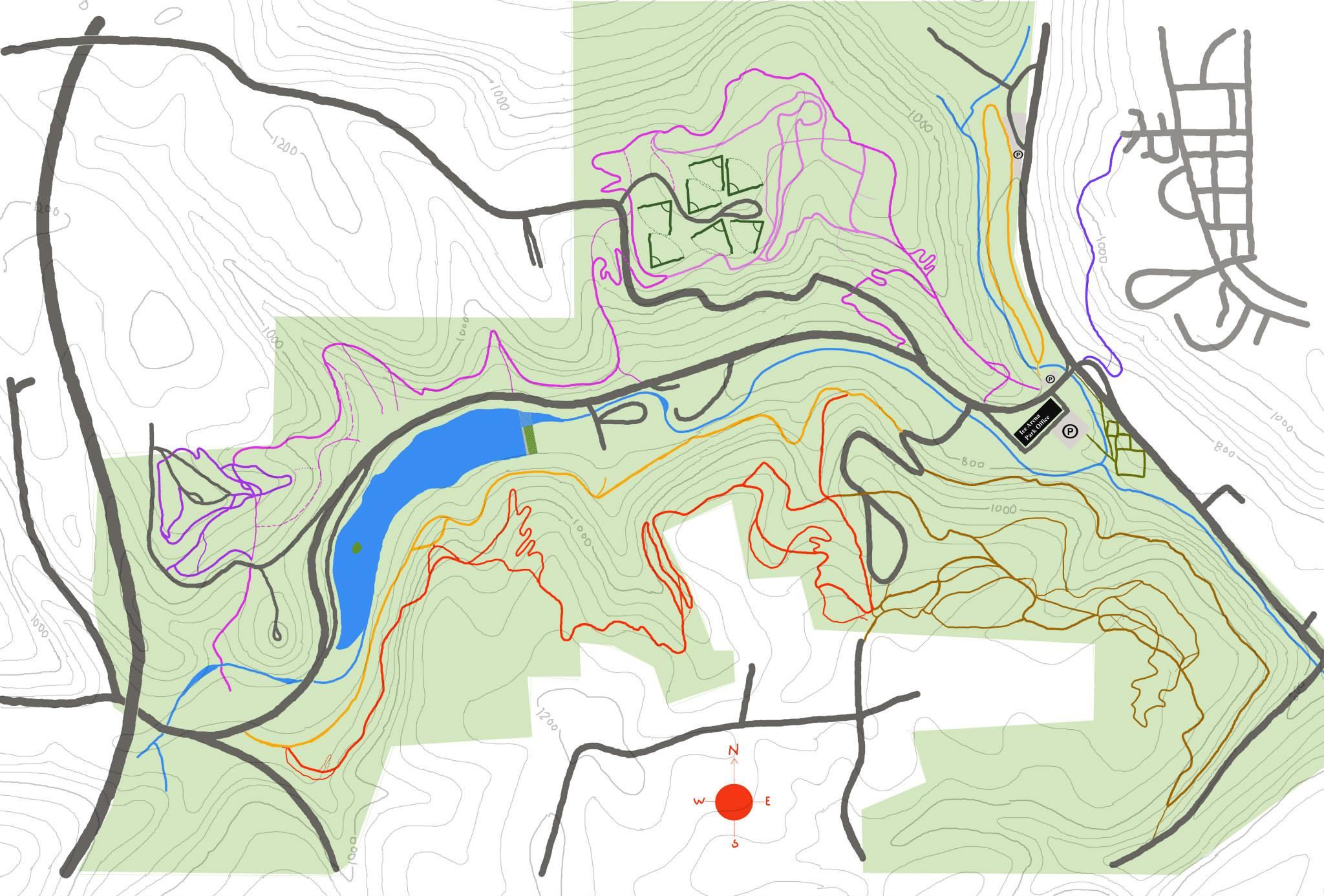 A topographic map displaying contour lines, elevation markings, and various land features including a lake and paths. The map includes color-coded lines indicating different elevations and detailed outlines of terrain with shaded areas representing vegetation or land use. A red dot in the center indicates the cardinal directions (N, E, S, W). Brady's Run County Park mountain bike trail.