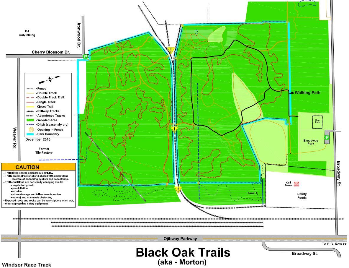 Map of Black Oak Trails located in Morton, showing various trails including double tracks, single tracks, and walking paths. The map includes park boundaries, wooded areas, and safety cautions regarding trail conditions. Notable features such as a dog park and nearby roads are also indicated. Black Oak mountain bike trail.