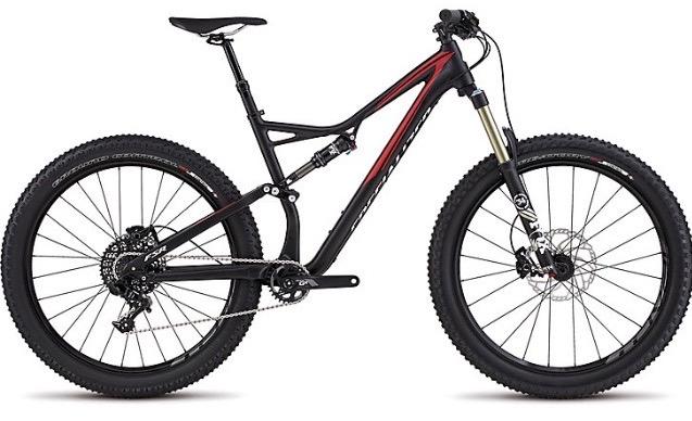 Specialized Stumpjumper FSR 6Fattie: A sleek, modern mountain bike with a black and red frame, featuring a front suspension fork, wide tires, and disc brakes, designed for off-road cycling.