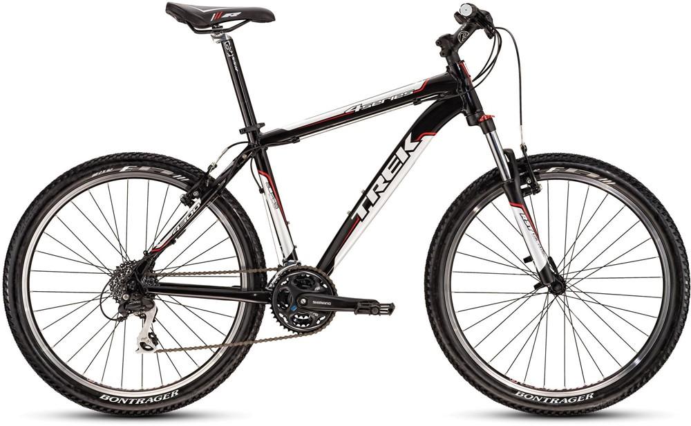 Trek 4300: A black and red Trek mountain bike featuring a sleek frame, front suspension, and rugged tires suitable for off-road riding. The bike is equipped with Shimano components and has Bontrager wheels, positioned on a neutral background.