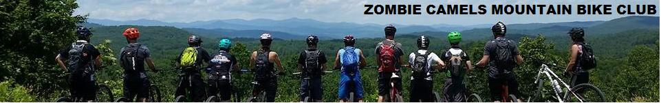 A group of mountain bikers stands side by side, overlooking a scenic view of rolling hills and mountains. They are wearing helmets and cycling gear, with various backpack colors visible. The text "ZOMBIE CAMELS MOUNTAIN BIKE CLUB" is displayed prominently at the top of the image.