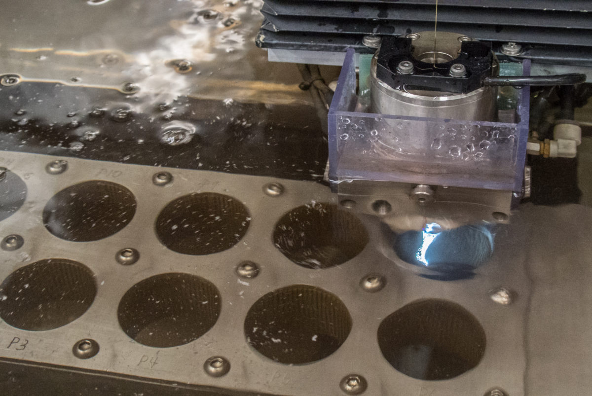The EDM machine cutting out a stack of driverings from heat-treated steel (photo: Aaron Chamberlain)