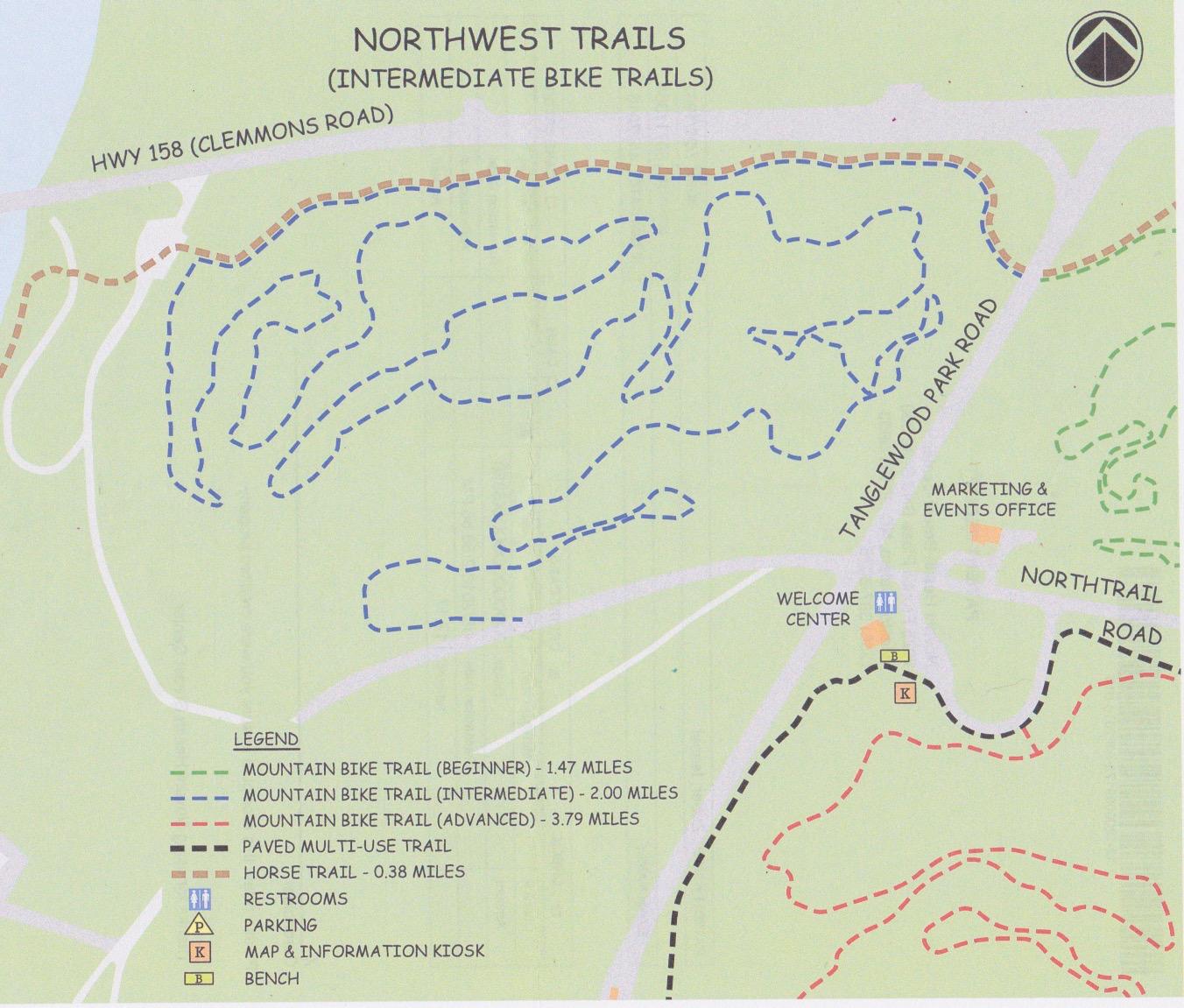 Map of Northwest Trails, showing intermediate biking paths, including mountain bike trails of varying difficulty levels. The legend indicates trail lengths and features such as restrooms, parking, and information kiosks. Major roads and landmarks like the Welcome Center and Marketing & Events Office are also labeled. Tanglewood Park mountain bike trail.