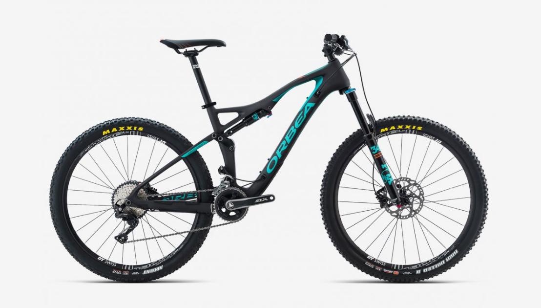 Orbea Occam AM M30: A sleek black mountain bike featuring turquoise accents, with a lightweight frame, front suspension, and wide tires. The bike is positioned against a white background, showcasing its modern design and high-performance components.