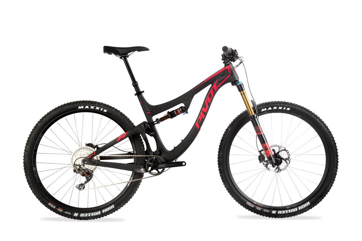 Pivot SwitchBlade: A black and red mountain bike with a sleek design, featuring a full suspension system, wide tires with "Maxxis" branding, and a modern cockpit. The bike is positioned against a white background, highlighting its components, including disc brakes and a comfortable saddle.