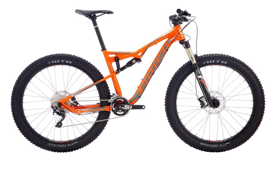 Cannondale Bad Habit: Mountain bike with an orange frame, featuring wide tires and a front suspension fork. The bike includes a drivetrain with multiple gears and is designed for rugged terrain.