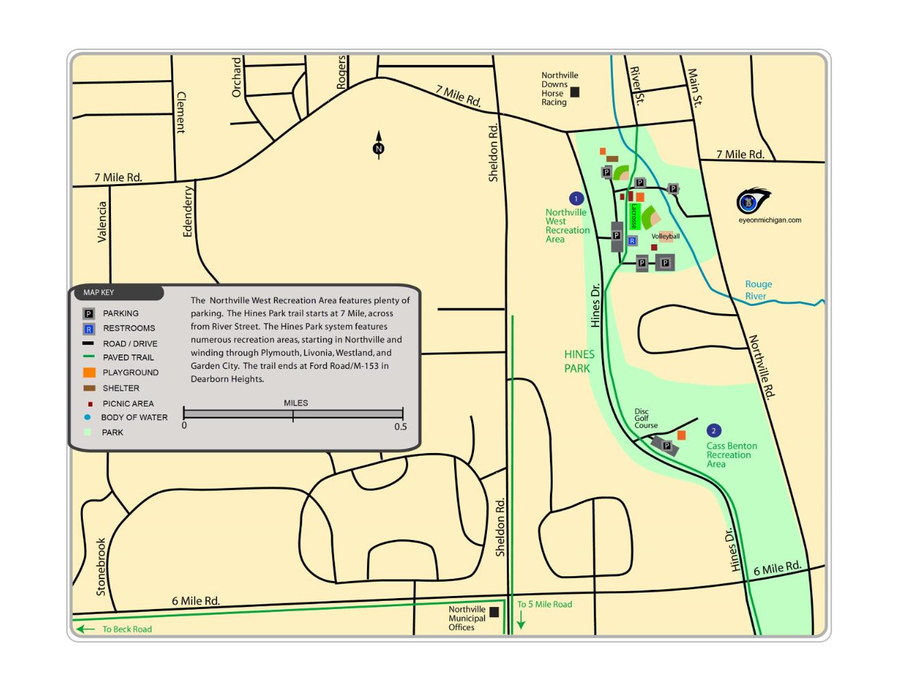 Map of the Northville West Recreation Area, highlighting key features such as parking, restrooms, playground, picnic area, body of water, and paved trails. The map includes the layout of Hines Park and nearby trails, indicating recreational facilities such as volleyball courts and a disc golf course, with a scale bar for distance reference. Hines Park Trail mountain bike trail.
