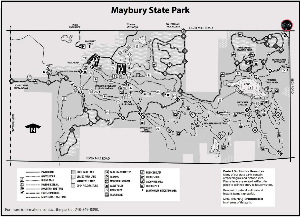 Map of Maybury State Park, showing trails, picnic areas, and facilities. Key features include parking, shelters, restroom locations, and access points for hiking, biking, and equestrian trails. The map also highlights historic sites and natural features, with a directional indicator for orientation. Maybury mountain bike trail.