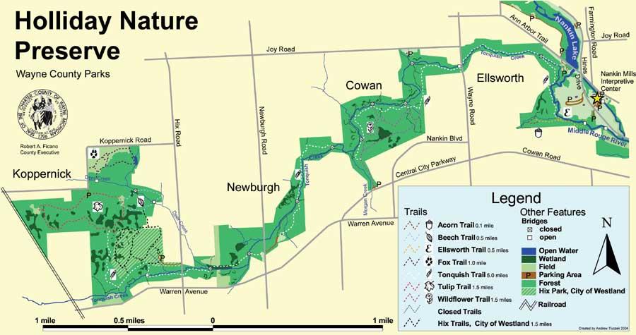 Map of Holliday Nature Preserve, showing trails, open water, wetlands, and other features. Includes a legend indicating trail conditions and locations of parking areas, parks, and railroad tracks. The map is oriented with north at the top and features various streets and road names in the surrounding area. William P. Holliday Forest and Wildlife Preserve mountain bike trail.