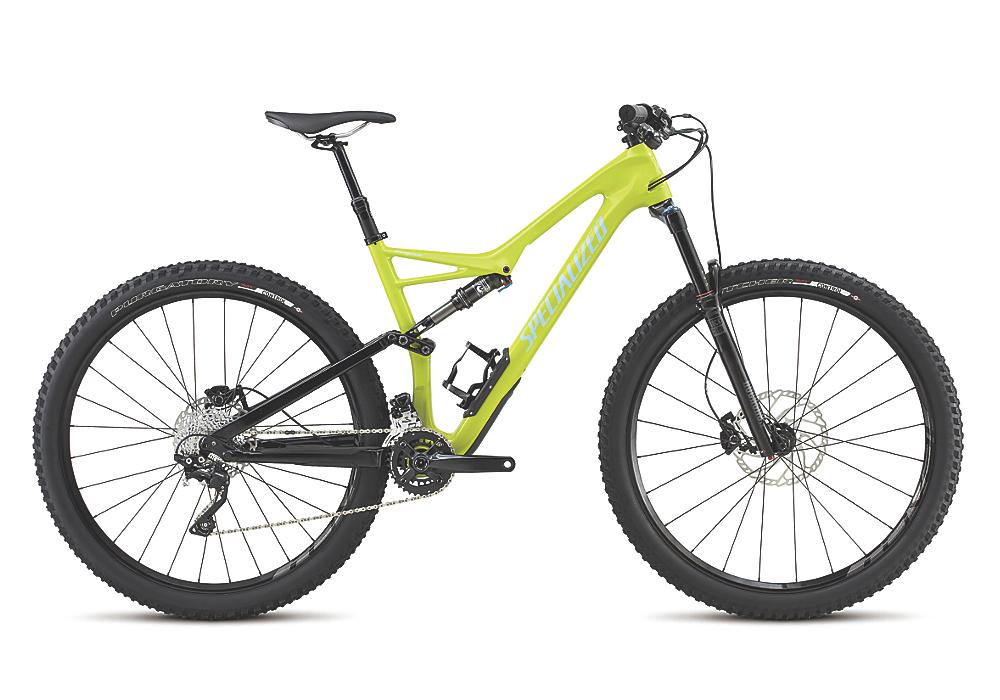 Specialized Stumpjumper FSR Comp Carbon 29: A bright lime green mountain bike with a sleek black frame and thick tires, featuring front suspension and a modern design. The bike is positioned sideways, showcasing its components such as the disc brakes, gear system, and a bottle holder.
