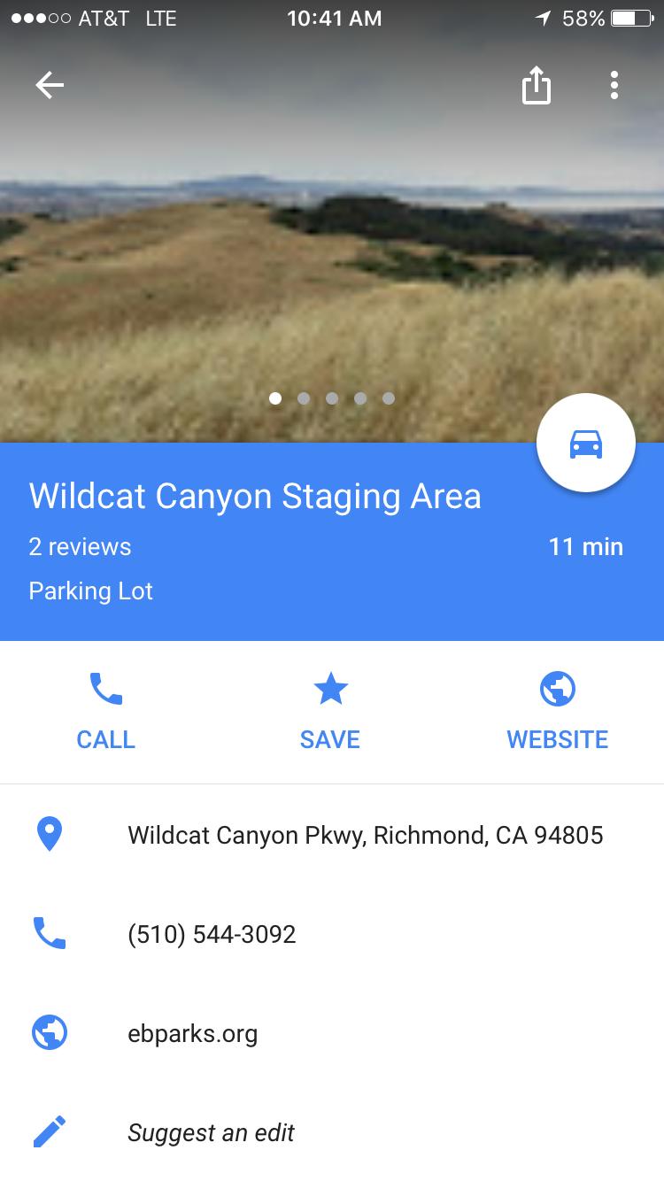 Specialized Rockhopper Comp 29: A scenic view of the Wildcat Canyon Staging Area, featuring rolling hills and a cloudy sky above. The image includes location and contact information for the parking lot at Wildcat Canyon Parkway, Richmond, CA, along with options to call, save, or visit the website.