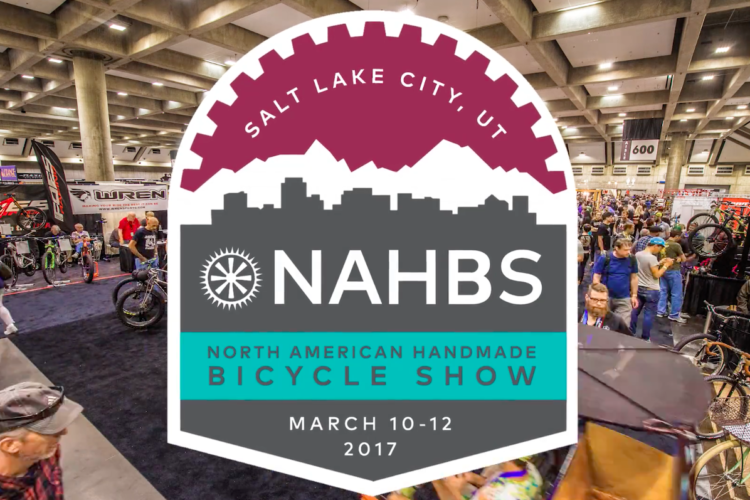 A vibrant scene from the North American Handmade Bicycle Show (NAHBS) held in Salt Lake City, Utah, showcasing various bicycles and attendees exploring the exhibits. The event details, including the date March 10-12, 2017, are prominently featured along with a logo that includes mountains and a city skyline.