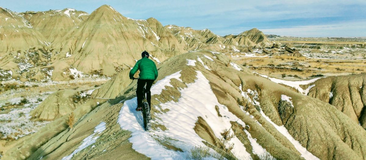 Momentum carries you through narrow sections, such as this spine I'm riding in Toadstool Geologic Park, Nebraska. Photo: Ridge Krisher