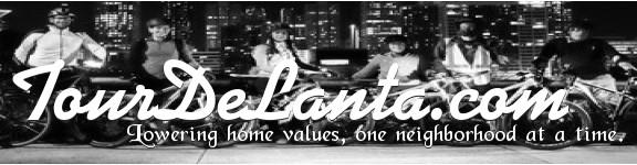 A black and white image featuring a group of six individuals on bicycles, posed in front of a city skyline at night. The text "TourDeLanta.com" is prominently displayed, along with the slogan "Lowering home values, one neighborhood at a time."