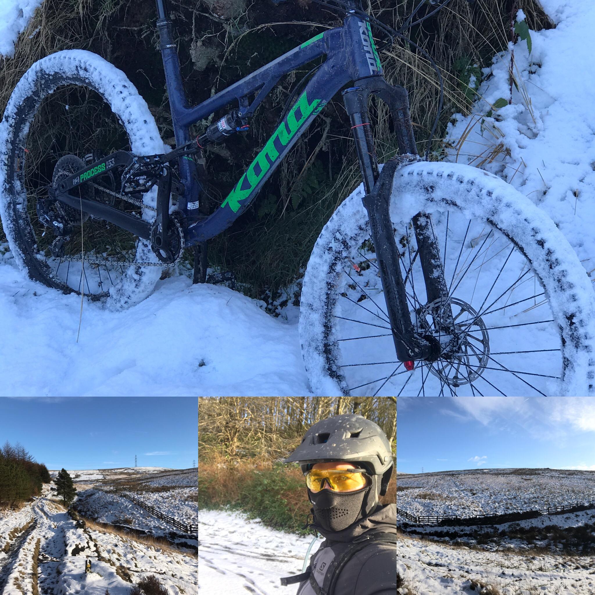 Kona Process 153: A mountain bike with snow-covered wheels rests against a snowy landscape. Surrounding images show a snowy trail winding through a forest, a cyclist wearing a helmet and protective gear, and a clear blue sky over a hilly terrain.
